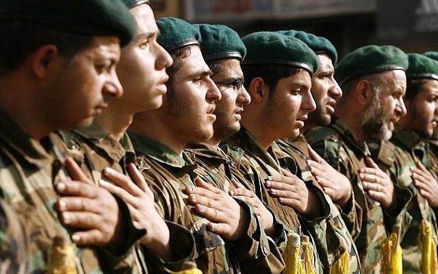 Hezbollah members mourn during the funeral of a comrade who was killed in combat alongside Syrian government forces in the Qalamun region, on May 26, 2015, in the southern Lebanese village of Ghaziyeh. (AFP PHOTO / MAHMOUD ZAYYAT)