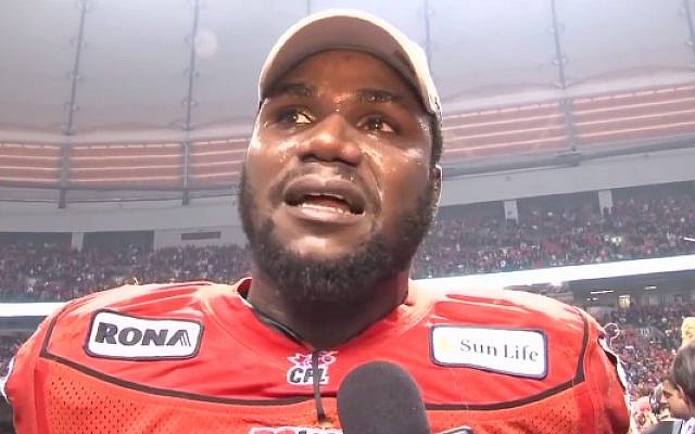 Canadian football star Khalif Mitchell, after winning the 99th Grey Cup Championship with the B.C. Lions in 2011. (screen capture: YouTube)