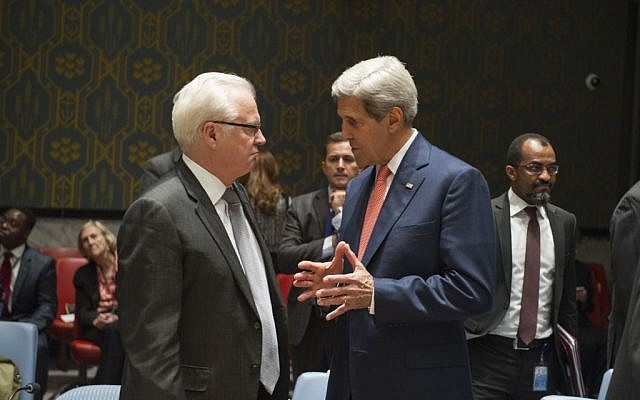 Vitaly Churkin, left, speaks to John Kerry at UN headquarters in New York on September 19, 2014. (photo credit: UN/Eskinder Debebe)