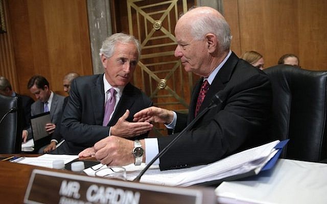 Senate Foreign Relations Committee Chairman Sen. Bob Corker (R-Tennessee), left, shakes hands with ranking member Sen. Ben Cardin (D-Maryland) during a committee markup meeting on the proposed nuclear agreement with Iran on April 14, 2015. (JTA/Win McNamee/Getty Images)