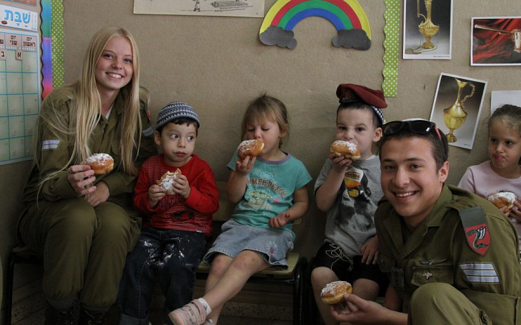 Soldiers considering conversion during a November 7, 2013 visit to a Kindergarten in Efrat on Hannukah (Gershon Elinson/ Flash 90)