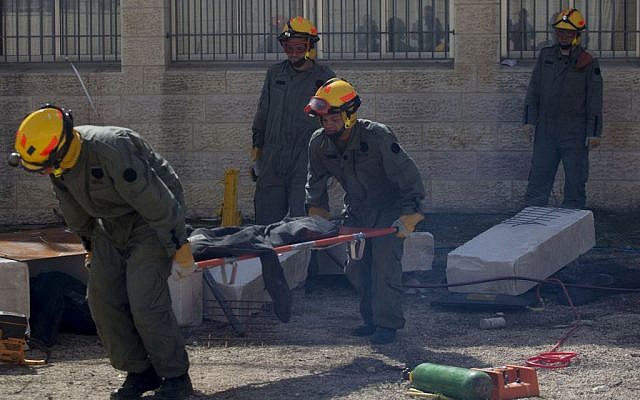 Israeli soldiers take part in an emergency drill held at a girls' school in Pisgat Zeev on February 24, 2014. (Flash90)