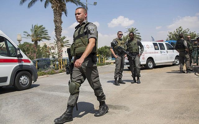 File photo: Police and rescue personnel at the scene where an Israeli security guard at the entrance to Ma’ale Adumim, outside of Jerusalem, was stabbed by an attacker who fled into a nearby Arab village, August 2014. (Photo credit: Yonatan Sindel/FLASH90)