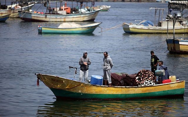 Illustrative: Palestinian fishermen, as seen in boats at the port of Gaza City, May 13, 2015 (Aaed  Tayeh/Flash90)