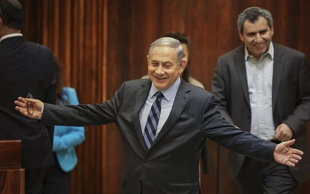 Prime Minister Benjamin Netanyahu reacts during a Knesset vote on expanding the number of ministers in the new government, May 13, 2015. (Photo by Hadas Parush/Flash90)