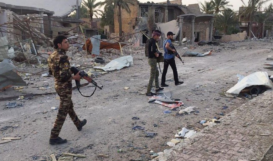 In this April 23, 2015 file photo, Iraqi security forces and tribal fighters regain control of the northern neighborhoods, after overnight heavy clashes with Islamic State group militants, in Ramadi, 70 miles (115 kilometers) west of Baghdad, Iraq. (AP Photo, File)
