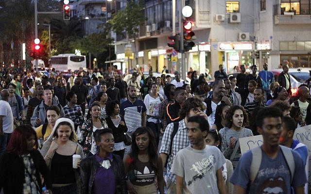 Israelis march in an anti-police brutality demonstration in Tel Aviv's Rabin Square on Sunday, May 3, 2015. (photo credit: Judah Ari Gross/Times of Israel staff)