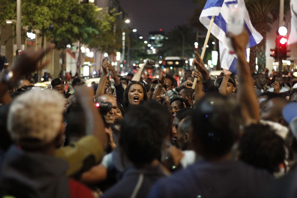 Ethiopian Israelis march in an anti-police brutality demonstration in Tel Aviv's Rabin Square on Sunday, May 3, 2015. (photo credit: Judah Ari Gross/Times of Israel staff)