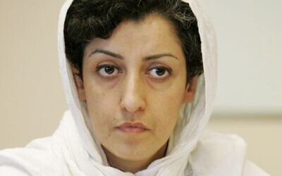 In this Monday, June 9, 2008 file photo, Iranian Narges Mohammadi, delegate of the Center for Human Rights Defenders, listens to a question during a press conference on the Assessment of the Human Rights Situation in Iran, at the UN headquarters in Geneva, Switzerland. (Magali Girardin/Keystone via AP, File)