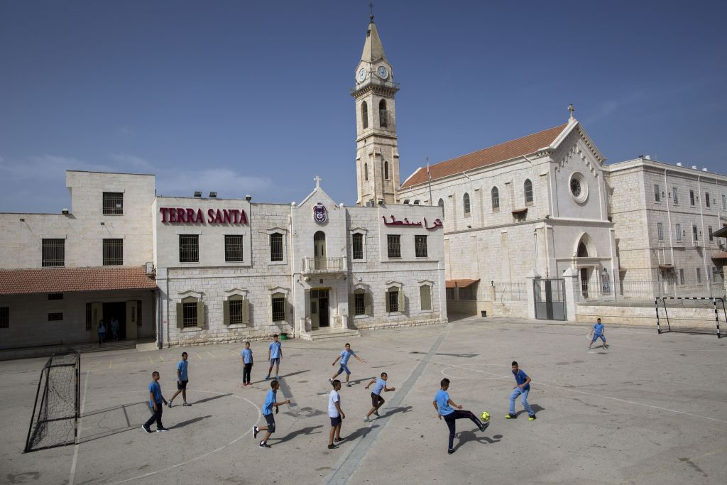 Arab Israeli Christian schoolchildren play soccer at the Terra Sancta School in the mixed Jewish-Arab city of Ramle, May 26, 2015. (AP/Oded Balilty)