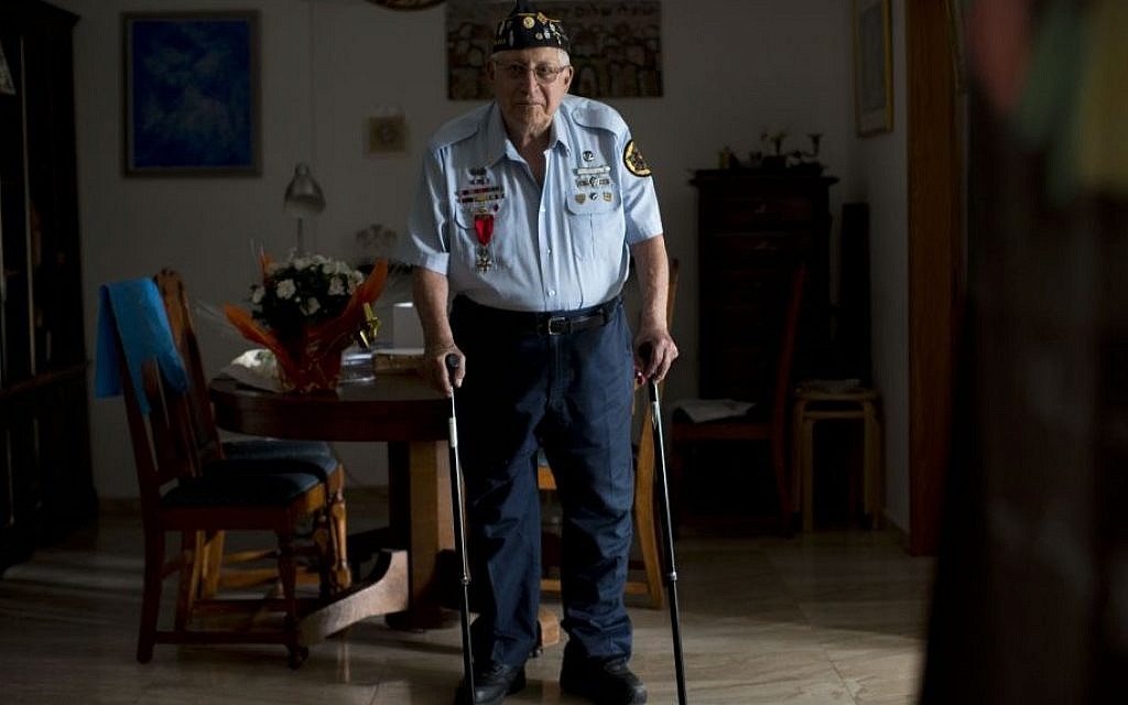 In this Tuesday, May 19, 2015 photo, U.S. Jewish World War II veteran Dan Nadel, who earned five battle stars leading combat engineer troops in the Battle of the Bulge and in the liberation of France, poses for a photo at his home in Jerusalem. (AP Photo/Oded Balilty)