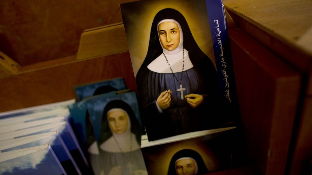 Booklets showing the likes of Marie Alphonsine Ghattas, a nun who lived in what was Ottoman-ruled Palestine in the 19th century, are on display in Church of the Rosary Sisters Mamilla in Jerusalem on May 7, 2015. (Photo credit: Dusan Vranic/AP) 