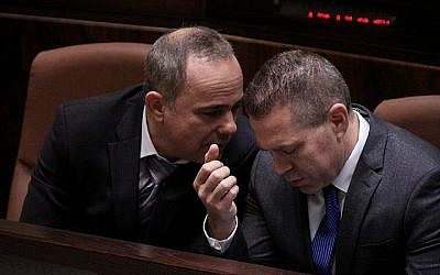 Likud lawmakers Gilad Erdan (R) and Yuval Steinitz at the Knesset plenum on Wednesday, May 14 2015, before the swearing-in of the new government. (Isaac Harari/Knesset Spokesperson)