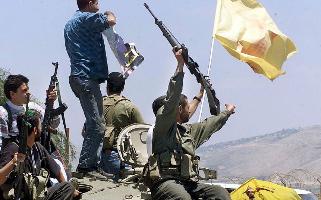 Hezbollah fighters celebrating on the day the IDF left South Lebanon, May 24, 2000. (AP: Enric Marti)