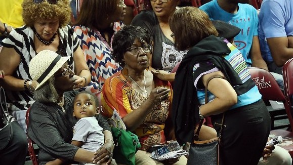Family members of the nine victims of the Emanuel AME Church shooting gather for a prayer vigil at the College of Charleston TD Arena June 19, 2015 in Charleston, South Carolina (Chip Somodevilla/Getty Images/AFP)