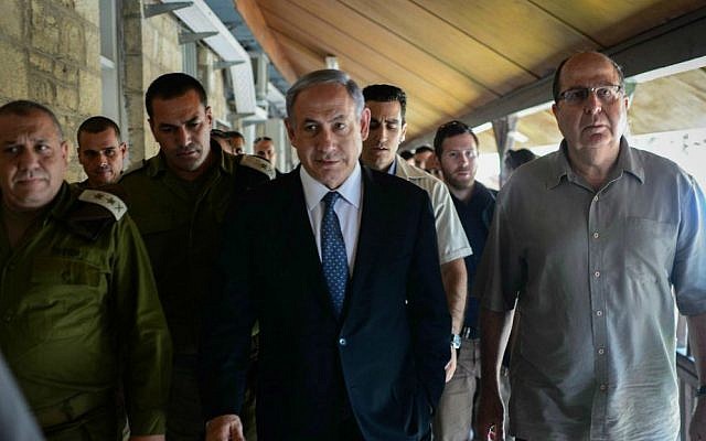 Prime Minister Benjamin Netanyahu (C), Defense Minister Moshe Ya'alon (R) and IDF Chief of Staff Lt. Gen. Gadi Eisenkot (L) at the IDF's Home Front Command in Ramle during a drill simulating an attack on the country, June 2, 2015. (Kobi Gideon/GPO)