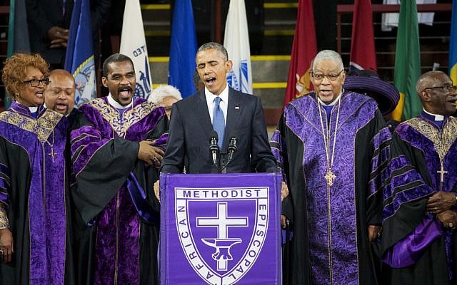 President Barack Obama sings 'Amazing Grace' during services honoring the life of Rev. Clementa Pinckney, Friday, June 26, 2015, at the College of Charleston TD Arena in Charleston, SC. Pinckney was one of the nine people killed in the shooting at Emanuel AME Church last week in Charleston. (AP Photo/David Goldman)