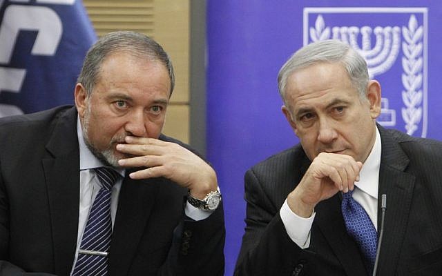 Prime Minister Benjamin Netanyahu and then-foreign minister Avigdor Liberman in the Knesset, February 3, 2014. (Yonatan Sindel/Flash90)