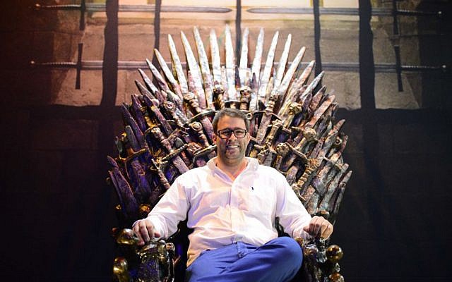 Knesset member Oren Hazan sits in a model of the Iron Throne from TV's 'Game of Thrones' during an exhibition in Tel Aviv on Sunday April 5, 2015 (Tomer Neuberg/Flash90)