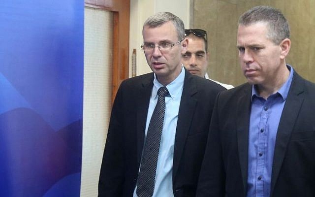 Public Security Minister Gilad Erdan, right, with Tourism Minister Yariv Levin as they arrive at the weekly cabinet meeting, Jerusalem, May 26, 2015. (Marc Israel Sellem/POOL/FLASH90)