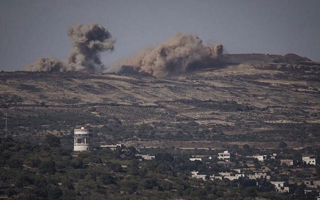 Explosions from the fighting in Syria seen from the Israeli side of the border on the Golan Heights due, June 16, 2015. (Basel Awidat/Flash90)