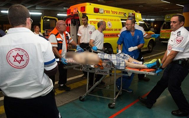 One of four Israeli men who were wounded in a drive-by shooting terror attack near Shvut Rachel, is brought to the Shaare Zedek Hospital in Jerusalem on June 29, 2015. (Yonatan Sindel/Flash90)