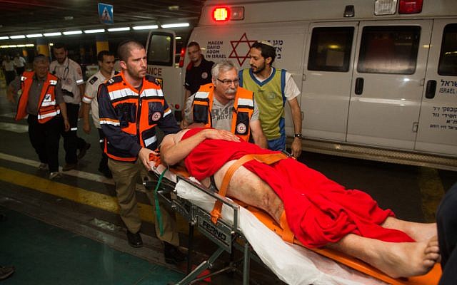 An Israeli wounded in a drive-by shooting attack is brought to Shaare Zedek hospital in Jerusalem, June 29, 2015. (Yonatan Sindel/Flash90)