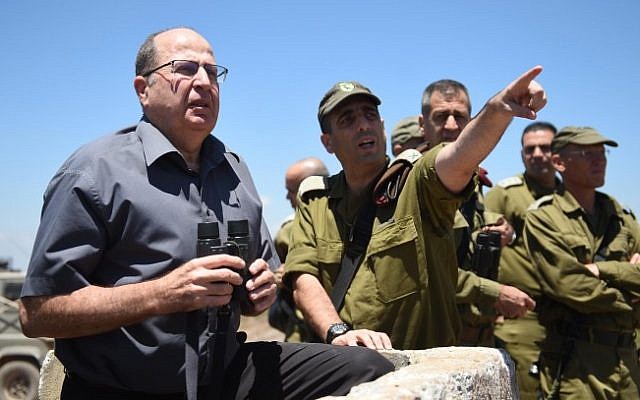 Defense Minister Moshe Ya'alon on the Golan Heights, northern Israel, June 30, 2015, looking toward Syria. (Eden Moladavski/Ministry of Defense)