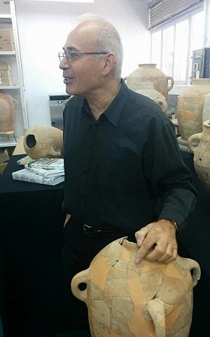 Professor Yosef Garfinkel of Hebrew University points to the Ishba'al inscription found in 2012 during excavations at Khirbet Qeiyafa (photo credit: Ilan Ben Zion/Times of Israel staff)