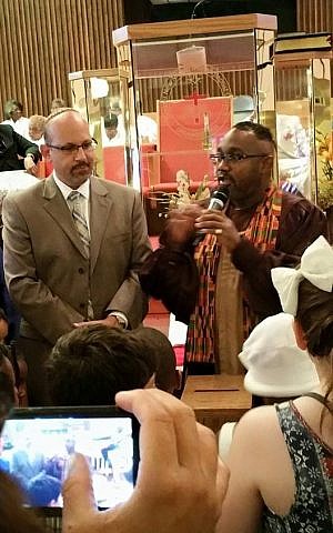 Pastor Kenneth Flowers and Rabbi Mark Miller offering prayer for the children at an interfaith prayer service on Sunday June 21, 2015 at the Greater New Mount Moriah Missionary Baptist Church in Detroit. (courtesy)