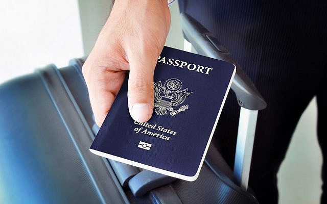 Illustrative: Man holding a US passport. (Shutterstock)