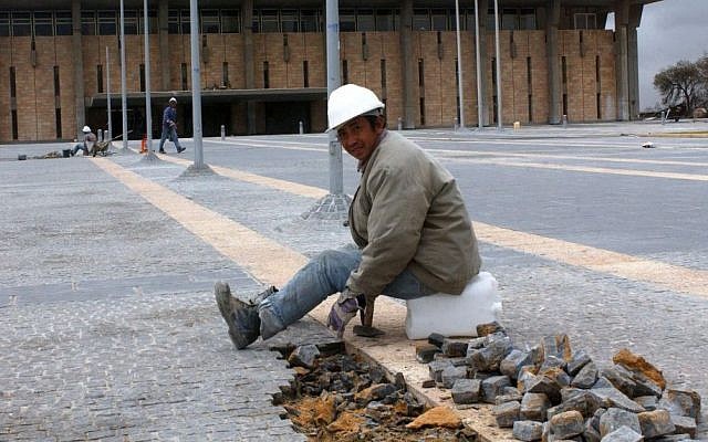 A Chinese construction worker sitting in front of the Knesset, the Israeli parliament building, January 08, 2004. (photo credit: Flash90)