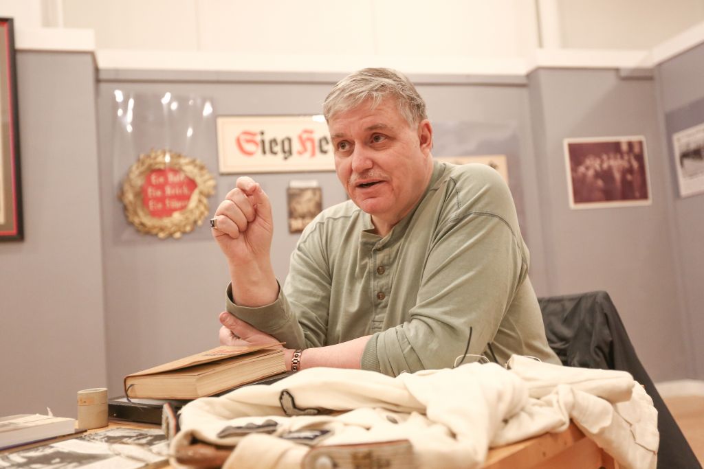 Darrell English, founder of the New England Holocaust Institute & Museum, based in North Adams, Massachusetts, explains the background behind some of his 3,000 artifacts connected to the Shoah (photo credit: Elan Kawesch/The Times of Israel)