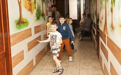 Children running in the hallway of the Zaporozhye JCC, May 20, 2015. (photo credit: Anna Moskalkova/WJR)