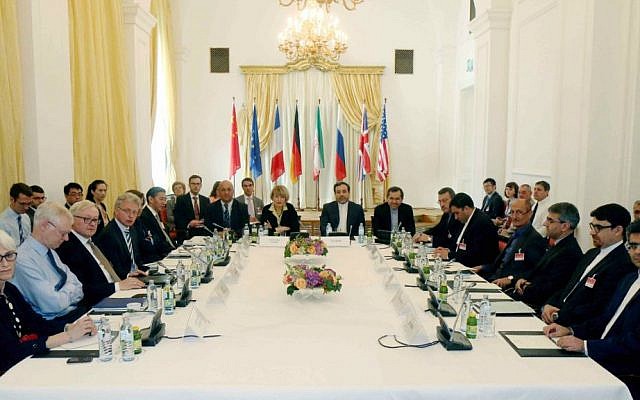 Delegates sit around a table prior to a bilateral meeting as part of the closed-door nuclear talks with Iran at a hotel in Vienna, Austria. (AP Photo/Ronald Zak, File)