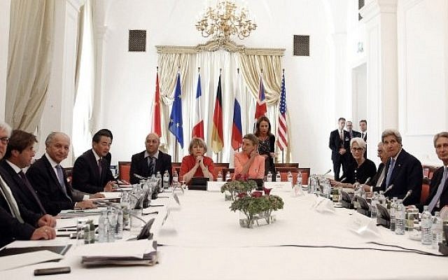 Foreign ministers sit around the table at the Palais Coburg Hotel, where the Iran nuclear negotiations were being held in Vienna, Austria on July 6, 2015.  (AFP/POOL/CARLOS BARRIA)