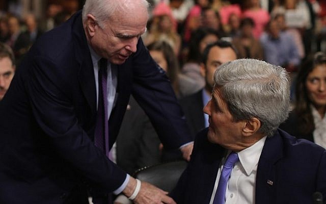Senate Armed Services Committee John McCain (R-AZ) (L) talks briefly with Secretary of State John Kerry during a break in a hearing about the nuclear deal struck between Iran and six nations, including the United States, on Capitol Hill July 29, 2015 in Washington, DC (Chip Somodevilla/Getty Images/AFP)