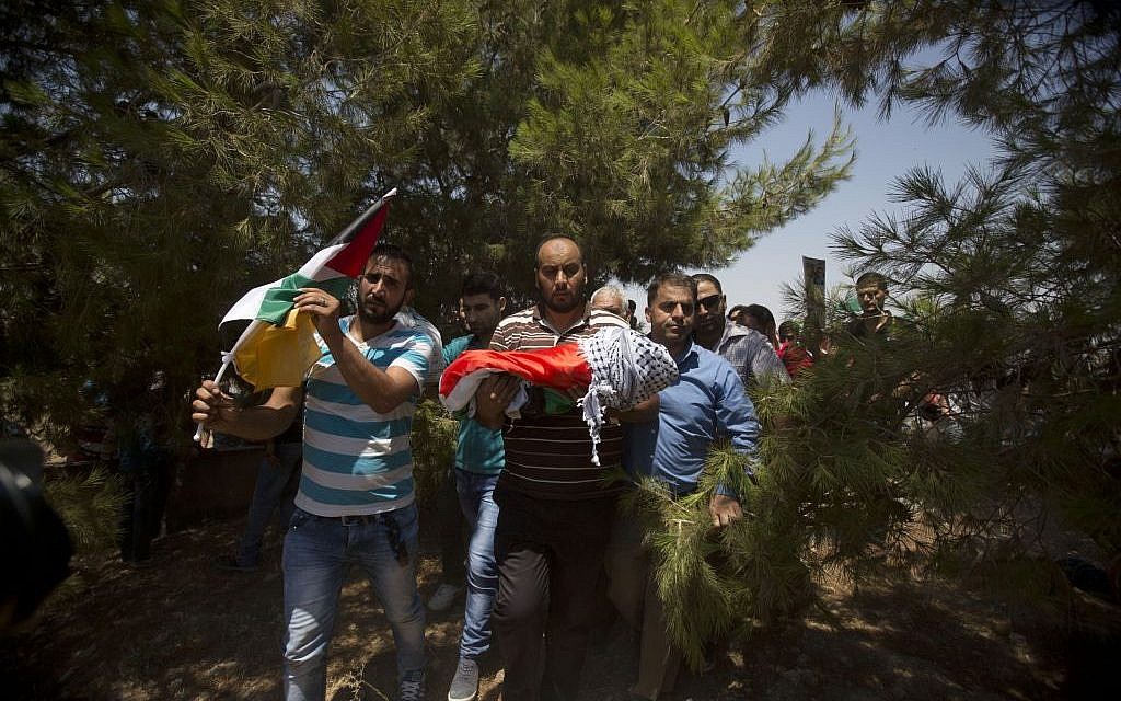 Palestinians carry the body of one-and-a-half year old Ali Dawabsha, killed in an apparent 'price tag' attack, during his funeral in Duma village near the West Bank city of Nablus, Friday, July 31, 2015. (AP Photo/Majdi Mohammed)