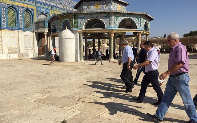 Knesset members from the Joint (Arab) List walk outside the Dome of the Rock at the Temple Mount in Jerusalem on Tuesday, July 28, 2015 (courtesy)