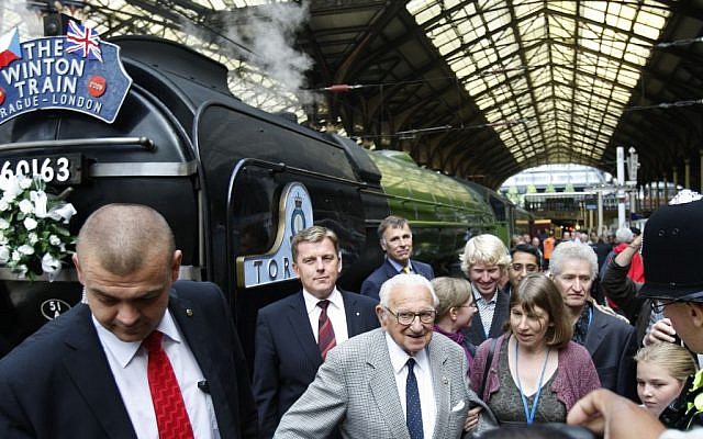 Nicholas Winton, center, at Liverpool Street station in London, September 4, 2009. (AP Photo/Kirsty Wigglesworth, File)