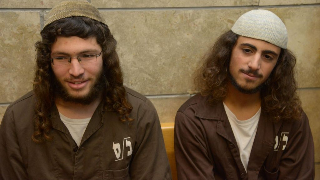 Yinon Reuveni (right) and Yehuda Asraf, suspected of vandalizing the church of the Multiplication of the Loaves and Fishes in Tabgha, on the shore of the Sea of Galilee, are seen at the Nazareth Magistrate's Court on July 29, 2015. (Photo by Basel Awidat/Flash90)
