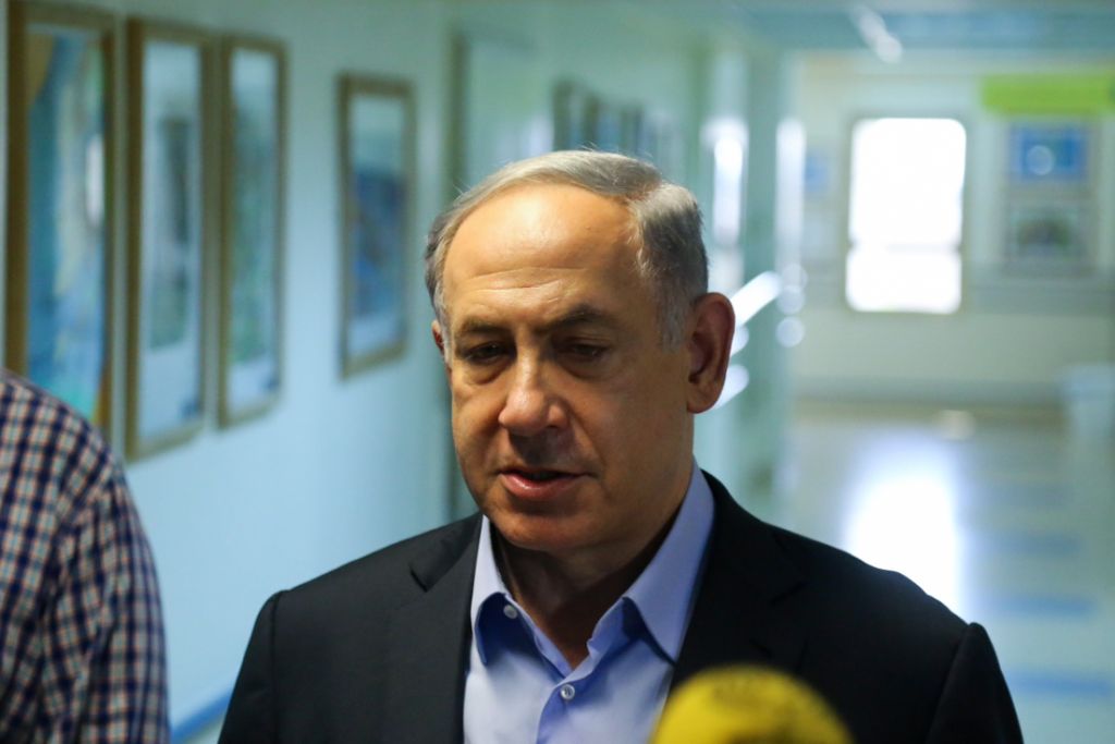 Prime Minister Benjamin Netanyahu gives a press statement after visiting the Dawabsha family at the hospital following an arson attack by alleged Jewish extremists in the Palestinian village of Duma, near Nablus, where the Dawabsha's infant son Ali was killed, and the rest of the family injured, on July 31, 2015. (Photo by FLASH90)