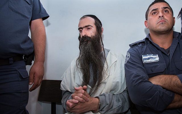 Yishai Schlissel, who stabbed six people at the annual Jerusalem Gay Pride Parade on July 30, 2015, is seen in the Jerusalem Magistrate's Court on July 31, 2015. (Yonatan Sindel/Flash90)