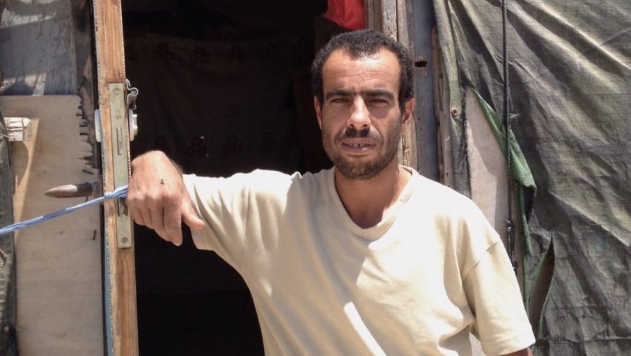 Mahmoud Nawajah stands outside his home in Susya, July 19, 2015 (Elhanan Miller/Times of Israel)