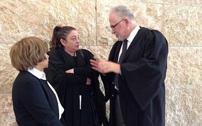 Lawyers Rabbi Uri Regev (far right) and Edna Meyrav with their client from Elad at a Supreme Court hearing in 2014. (courtesy Hiddush)
