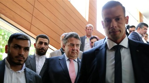 German Vice Chancellor and Economy Minister Sigmar Gabriel, center, makes his way to a conference after a round of talks with Iranian Oil Minister Bijan Zanganeh in Tehran, Iran, July 20, 2015 (AP Photo/Ebrahim Noroozi)