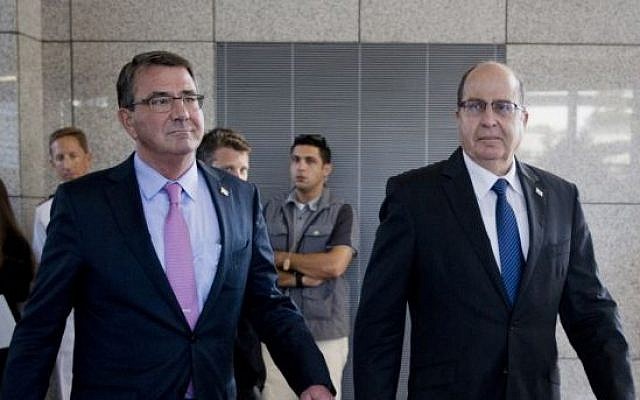 US Defense Secretary Ashton Carter (left), and Israeli Defense Minister Moshe Ya'alon (right) arrive for their joint news conference at the headquarters of the Israel Defense Forces in Tel Aviv on July 20, 2015. (AP/Carolyn Kaster, Pool)