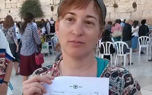 Women of the Wall board member Rachel Cohen Yeshurun holding her arrest warrant following her detention in Jerusalem on July 17, 2015.  (photo credit: Facebook/Women of the Wall)