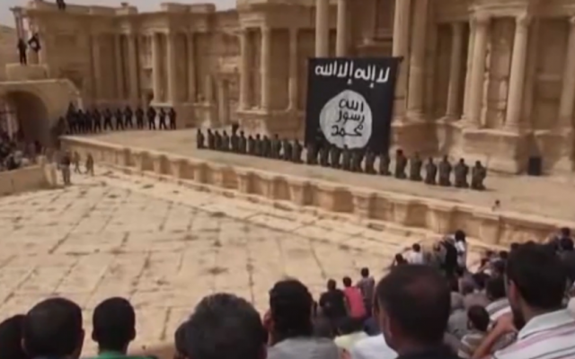 Image from an Islamic State video showing the mass execution of Syrian soldiers on the stage of the amphitheater in the ancient city of Palmyra, Syria shortly after the group captured the city on May 21, 2015.  (screen grab: YouTube)