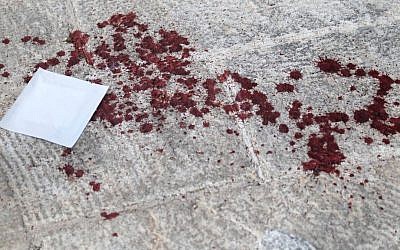 Bloodstained sidewalk at the scene of a stabbing at the annual Jerusalem Pride Parade on July 30, 2015. (Eric Cortellessa/Times of Israel)